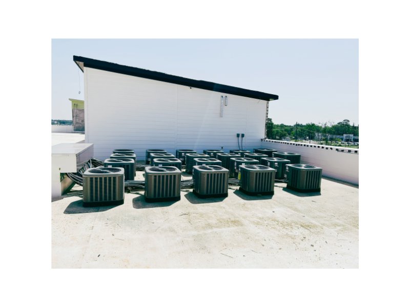 Multiple rooftop air conditioning condenser units installed on a commercial building by HP Mechanical LLC in Santa Rosa, CA.