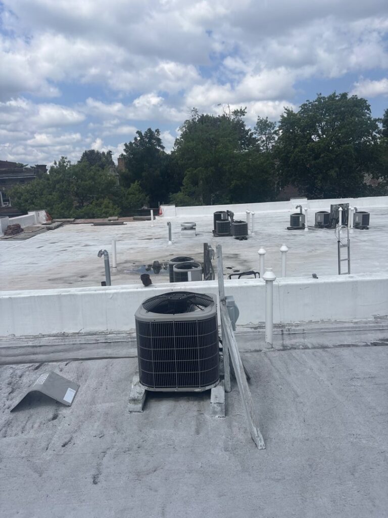 Multiple outdoor AC condenser units installed on a commercial rooftop by Best Plumbing Heating & Cooling Contractors in Albany, NY.