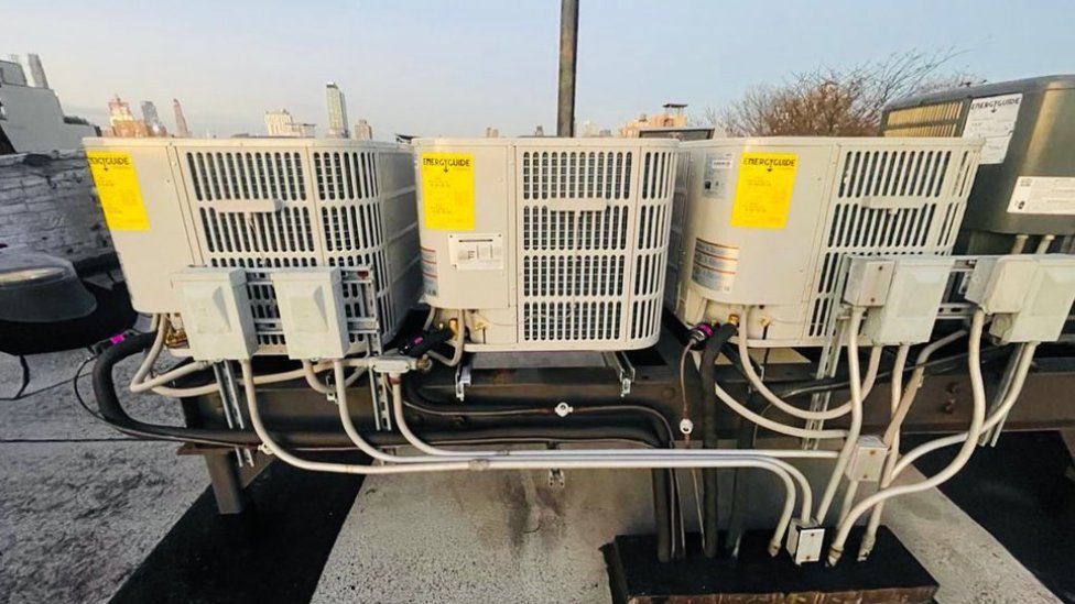 Multiple outdoor HVAC condenser units installed on a commercial rooftop by Deboque Duct Design Corp. in Staten Island, NY