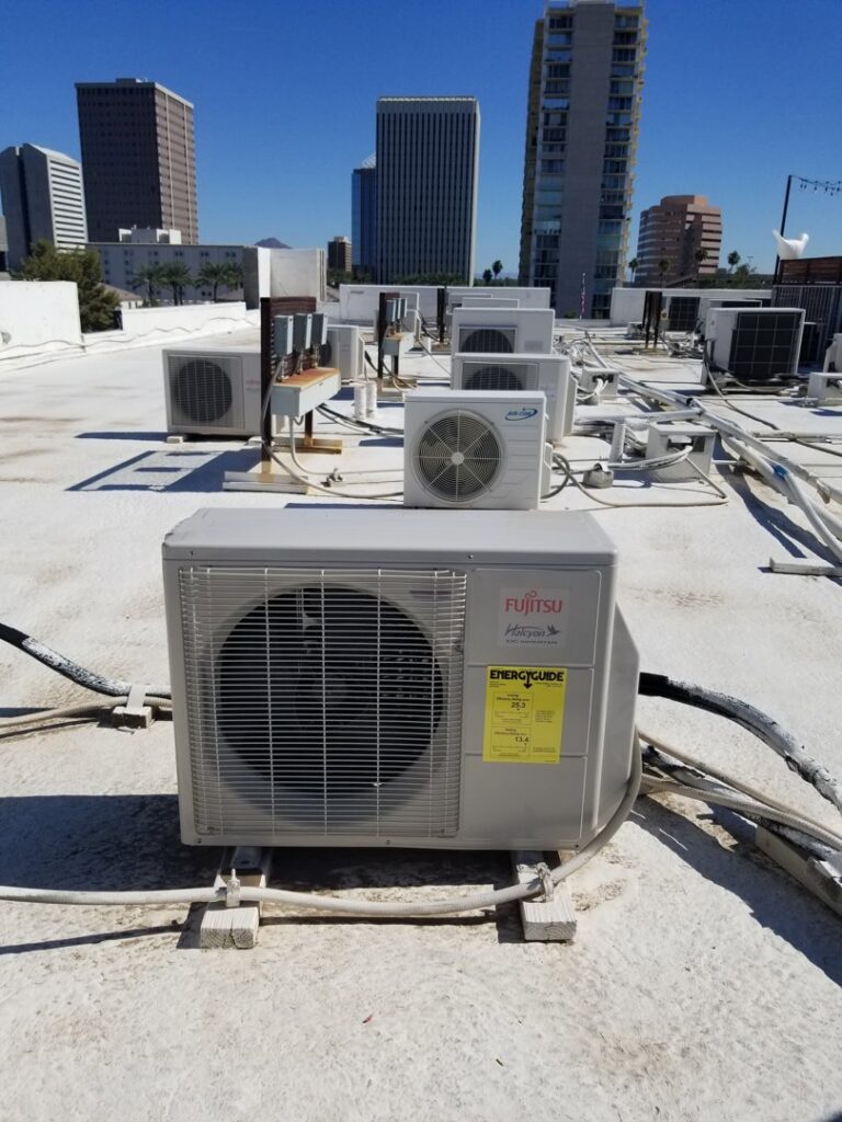 Multiple rooftop mini-split HVAC condenser units on a commercial building in Phoenix, AZ, serviced by Kade Mechanical.