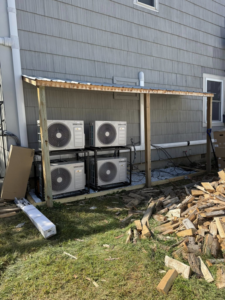 Multiple Samsung heat pump units installed under a wooden shelter by Rockys electric in La Junta, CO.