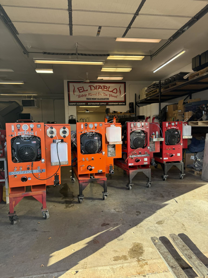 Multiple truck mount carpet cleaning machines displayed in the showroom at El Diablo Truck Mounts in Rapid City, SD.