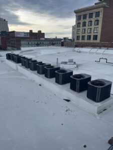 Multiple York brand HVAC condenser units lined up on a commercial rooftop, installed or serviced by Hvaclife in Minneapolis, MN.