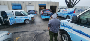 Musser's Advanced Carpet Care fleet of service vans and staff preparing for jobs in North Kansas City, MO.