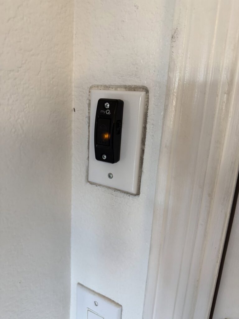 A myQ smart garage door wall control panel installed by Calavera Garage Doors in Mesa, AZ