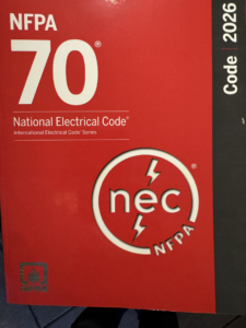 The National Electrical Code (NFPA 70) book, essential for electricians at John Murphy, Jr. Electrical Construction & Engineering, Inc. in Rockland, MA