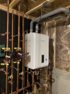 A Navien boiler and heating system installation with copper piping by Excel Mechanical and Construction LLC in Brunswick, ME