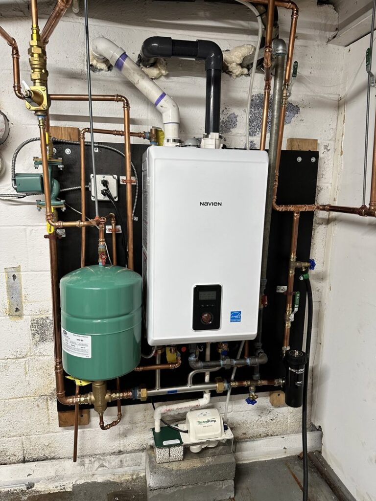 A Navien tankless water heater and associated plumbing installed by Mueller Mechanical HVAC in Philadelphia, PA.