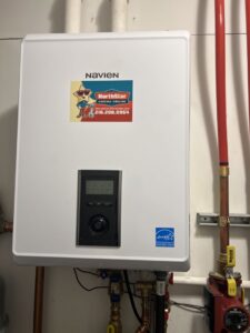 A Navien tankless water heater or boiler unit with a NorthStar Services sticker, installed in South Haven, MN