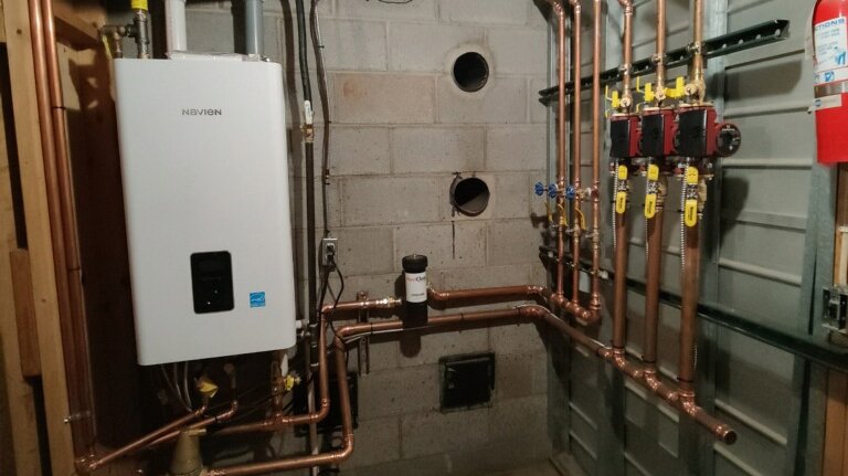 A newly installed Navien tankless water heater with copper piping by TruTemp Heating & Cooling LLC in Ijamsville, MD.