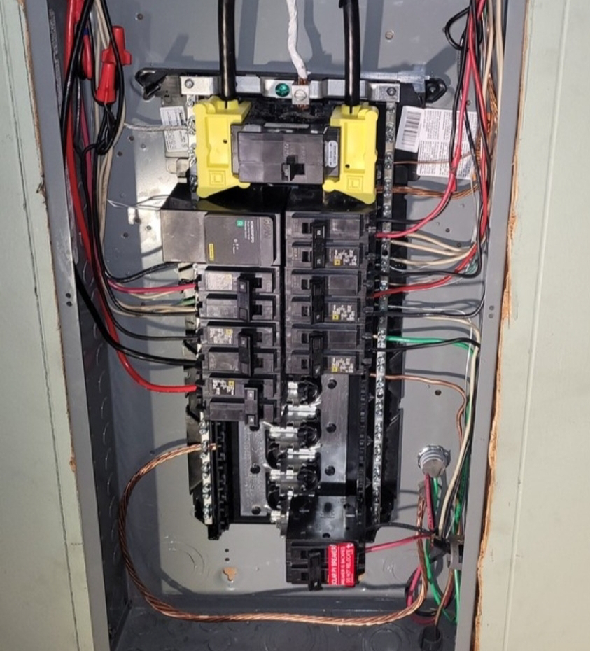 A close-up view of a neatly wired electrical breaker panel installed by ANT POWER LLC in Tacoma, WA.