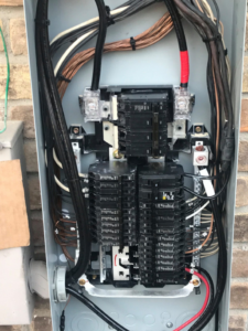 A close-up view of a neatly wired electrical panel interior by Pressed Down Electric LLC in Rockwall, TX.