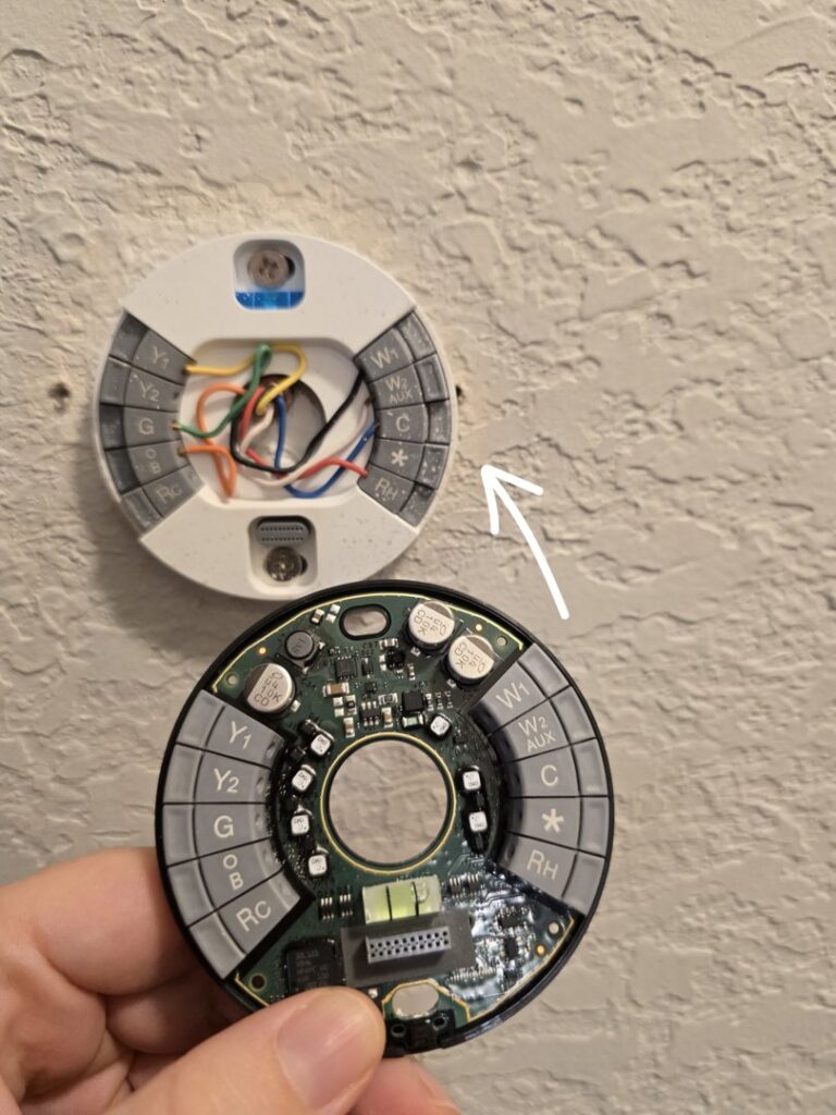 Nest thermostat wiring and installation in progress by ABS Electrical Services in Rogers, AR.
