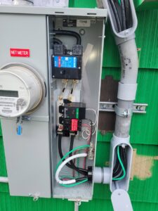 A net meter electrical service installation with wiring and breakers completed by Ant Power Electric in Tacoma, WA.