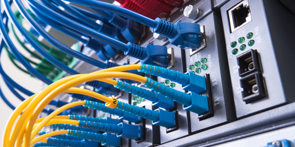 Close-up of network cables plugged into a switch, installed by Access Hardware Inc in Honolulu, HI