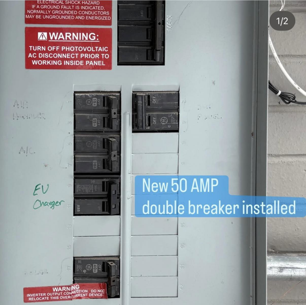 A new 50 AMP double breaker installed in an electrical panel for an EV charger by Midway Electric in Columbia, MO