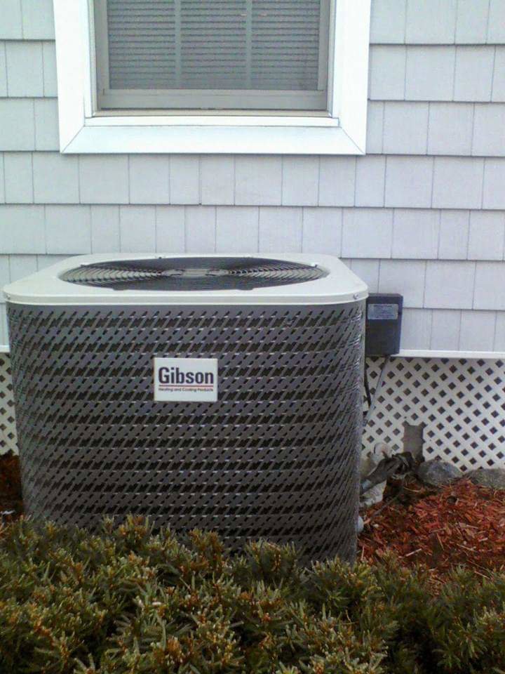A newly installed Gibson outdoor AC unit next to a residential building by Allwaysthere Heating and Cooling in Frederick, MD
