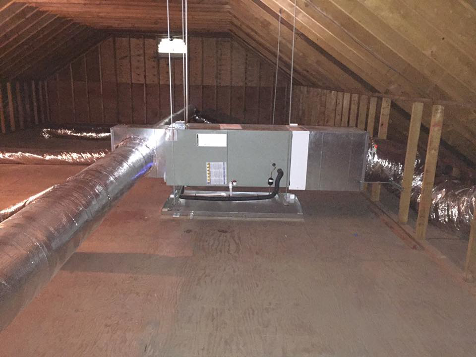 A newly installed air handler unit and ductwork in an attic by R&M Mechanical Services LLC in Milford, CT.