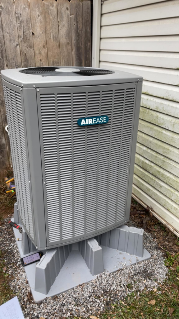 A newly installed AIREASE outdoor air conditioning unit by Viking Mechanical LLC, providing HVAC services in Rapid City, SD.