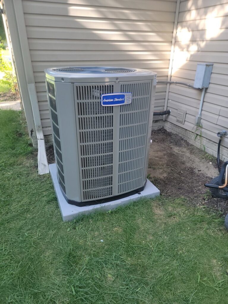 A newly installed American Standard outdoor air conditioning unit by Shrek Heating & Air Conditioning in Toledo, OH.