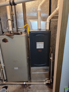 A new Trane furnace installed next to an older unit with ductwork and piping by High Standard HVAC LLC in Cheyenne, WY.