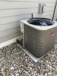 A new Bryant outdoor HVAC condenser unit next to an older York unit, indicating replacement or service by Carpenter Mechanical in Columbus, OH.