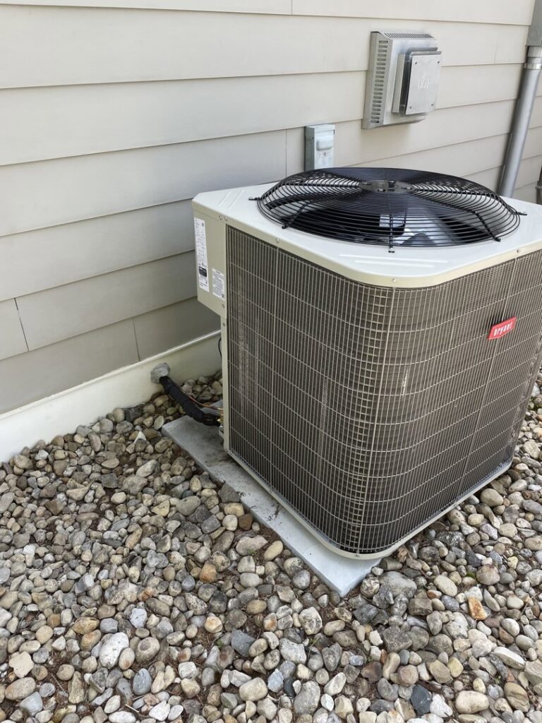 A new Bryant outdoor HVAC condenser unit next to an older York unit, indicating replacement or service by Carpenter Mechanical in Columbus, OH.