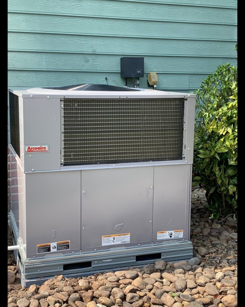 A newly installed Arcoaire outdoor HVAC unit by Southern Comfort Heating/Cooling/Gas in Fayetteville, NC.
