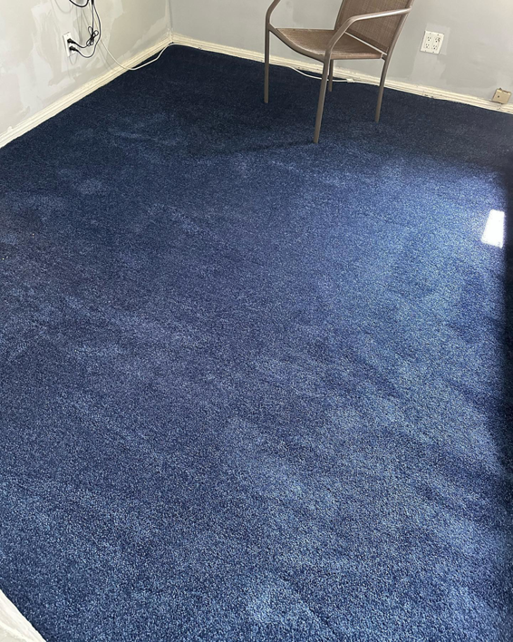 New blue carpet installation in a room by Jimenez Carpet in Lynwood, CA