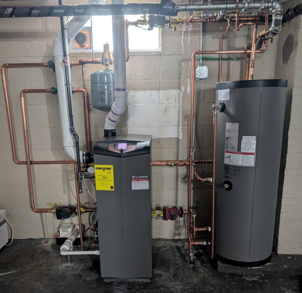 A newly installed high-efficiency boiler and water heater system with copper piping by Voegeli Heating & A/C, Inc. in Toledo, OH.