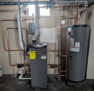 A newly installed high-efficiency boiler and water heater system with copper piping by Voegeli Heating & A/C, Inc. in Toledo, OH.