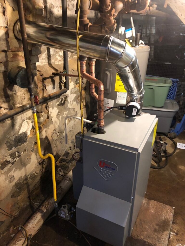 A new U Heating boiler installation with updated piping and venting in a basement by Green Air Heating&Cooling in Philadelphia, PA.