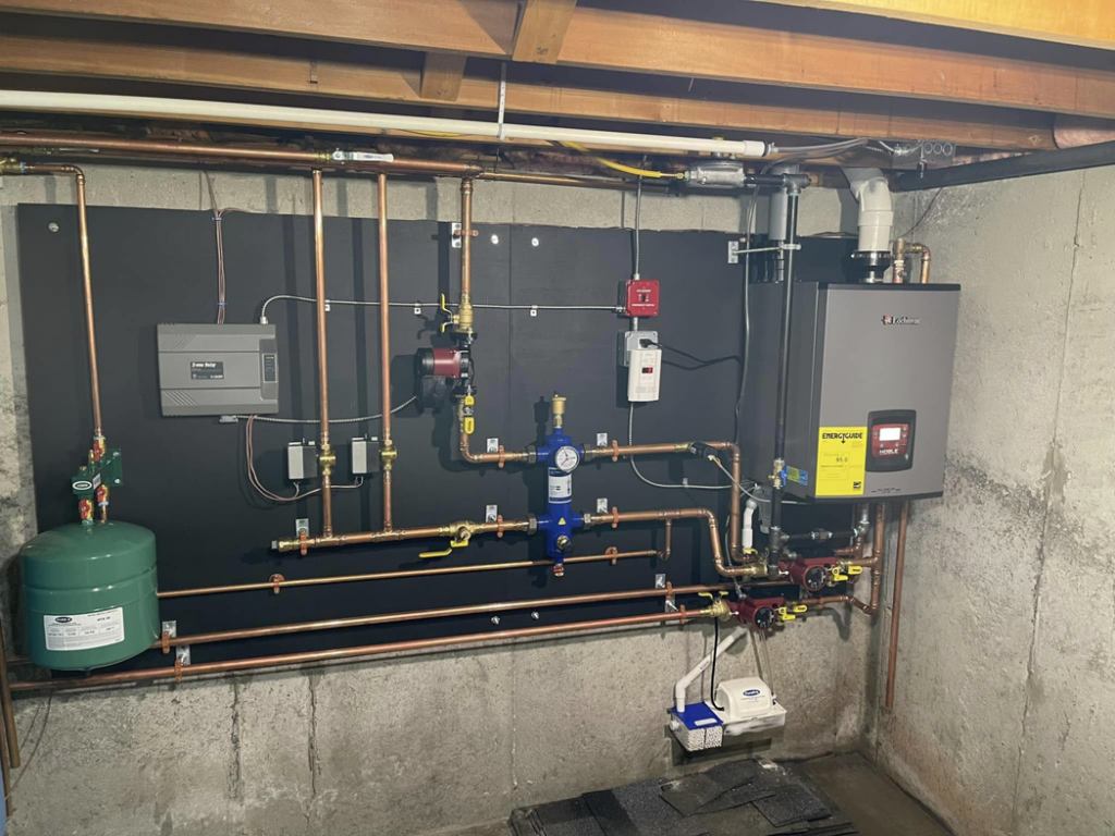 A new boiler and tankless water heater installation by Aaron Hamilton Heating in Brunswick, ME.