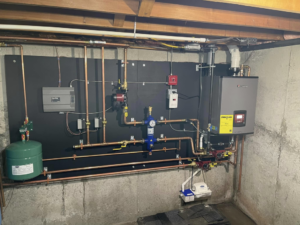 A new boiler and tankless water heater installation by Aaron Hamilton Heating in Brunswick, ME.