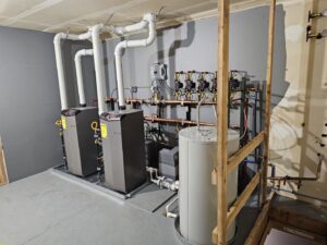 A newly installed boiler and water heater system with extensive piping by Perfect Temp LLC in Bozeman, MT.