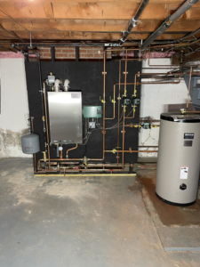 A newly installed boiler and water heater system by Tony Marzano Plumbing & Heating LLC in Hartford, CT.