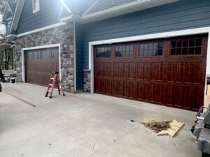 Two newly installed brown garage doors on a modern home by Align Garage Door in Ringgold, GA.