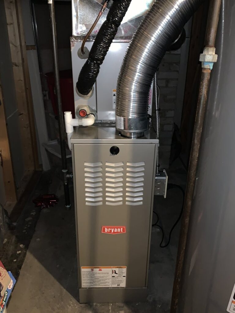 A new Bryant furnace installation with ductwork in a utility space by Proficient Heating & Cooling in Livonia, MI.