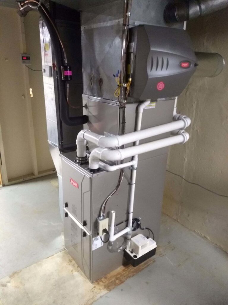 A new Bryant furnace installation with extensive PVC piping and ductwork by Proficient Heating & Cooling in Livonia, MI.