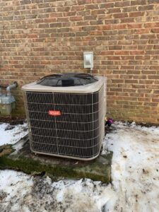 A new Bryant HVAC unit installed outdoors, ready for winter service by U.S. HVAC Services in Madison, AL.
