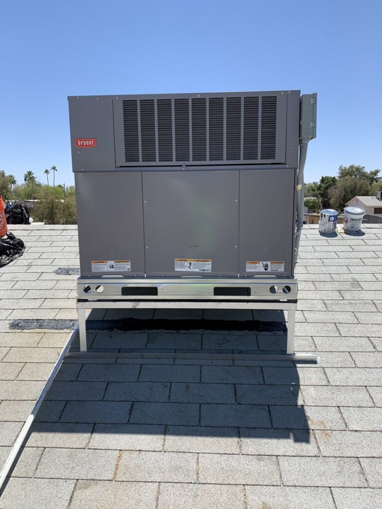 A new Bryant rooftop HVAC package unit installed on a stand by Arizaz Heating & Cooling in Chandler, AZ.
