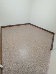 A newly installed light-colored carpet in a room by Advanced Concrete and Deck Coating in St. George, UT