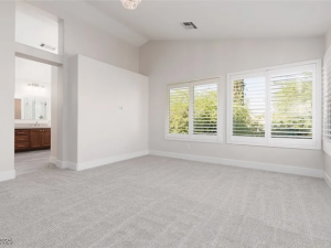 Newly installed light gray carpet in a spacious bedroom by Floors by Aldaba LLC in North Las Vegas, NV.