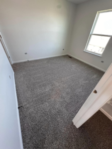 A bedroom with new carpet installed by J&A Flooring Masters Corp. in Joliet, IL.