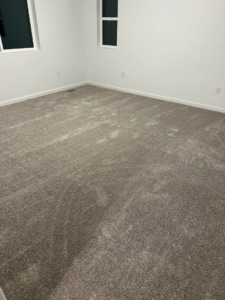 A newly installed grey carpet in a bedroom by Millennium Flooring .Co in Salt Lake City, UT.