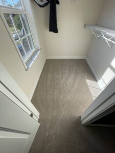 Newly installed light brown carpet in a small closet by A-1 Floors in Fairfield, CA.