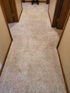 A newly installed light-colored carpet in a residential hallway by Carpet Center Huron SD in Huron, SD.