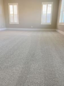 A newly installed light-colored patterned carpet in a room by Mendez Flooring in West Reading, PA.