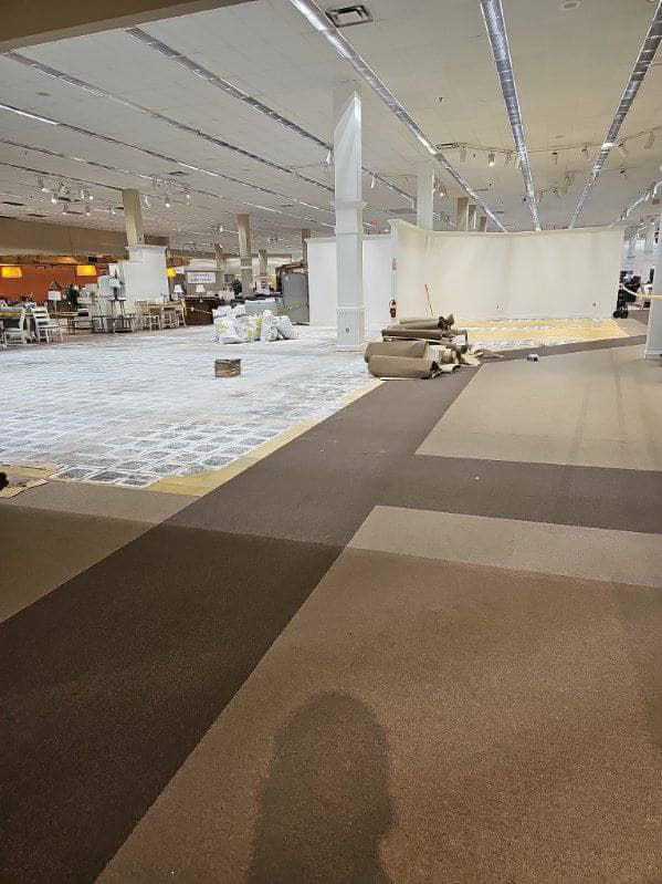 New carpet installation preparation with old carpet removed and new rolls ready by Universal Flooring LLC in Las Cruces, NM