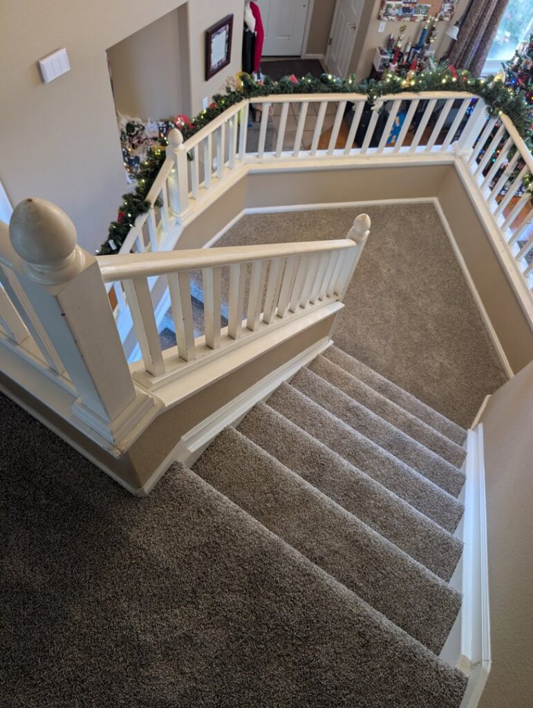 A newly installed carpet on a staircase and landing area by Carpet Direct of Northern Colorado in Loveland, CO.